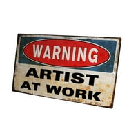 Novo u alternativama, smiješni znak na zidu-upozorenje umjetniku na poslu